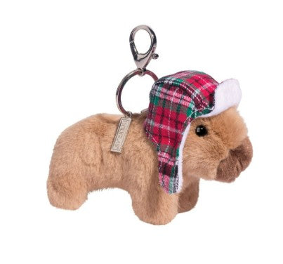 The Douglas Winter Capybara Bag Charm is a plush brown capybara keychain with a red and green plaid winter hat with ear flaps, attached to a metal keyring and clasp—perfect as a cute winter accessory.