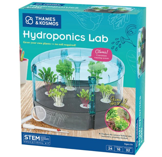 The Thames & Kosmos Hydroponics Lab box displays a transparent planter with thriving plants, test tubes, and a magnifying glass arranged on a desk. Prominent text highlights that you can “Grow 3 Types of Greens,” and the kit is recommended for ages 8 and up. Inspire young scientists to explore hydroponic gardening with this engaging STEM kit.