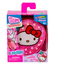 The Moose Toys Real Littles Hello Kitty & Friends Backpack by Toysmith is a pink, backpack-shaped mini collectible packaged in a box labeled "Scented Surprise! Strawberry." Inside, you'll find 6 real working Hello Kitty-themed stationery items and fun Sanrio accessories. The packaging contains a small parts warning and is recommended for ages 6 and up.