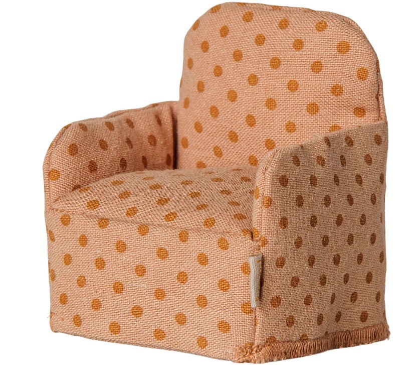 The Maileg Folding Chair, Mouse - Dots by Maileg is a charming piece of miniature furniture featuring light orange upholstery with darker orange polka dots, short armrests, and a cushioned seat—perfect for adding whimsical style to playrooms or dollhouse displays.