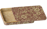 The Maileg Metal box with sliding lid - Blossom - Heather is a rectangular miniature storage box from Maileg, featuring a charming vintage floral pattern in beige and dusty pink. The partially open sliding lid reveals an interior with a coordinating design, making it perfect for keeping your cherished Maileg treasures safe and organized.