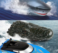 Jupiter Creations, Inc's CrocSharkboat R/C 2.4G set includes two remote-control vehicles—a shark with an open mouth and visible teeth, and a crocodile with a detailed, realistic face—designed to spark adventurous play for kids as they glide across the water.