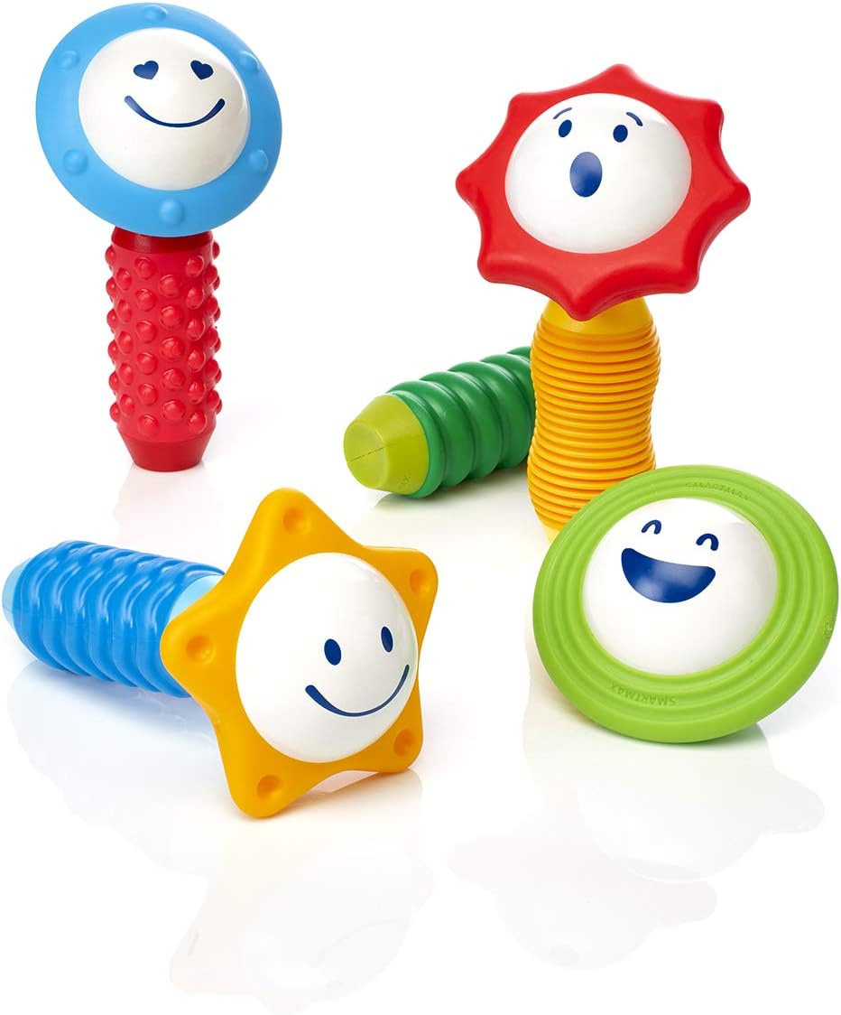 The Smart Toys Smartmax My First Sounds & Senses set features four colorful rattles with cheerful sun and flower designs and textured blue, red, yellow, and green handles to promote sensory exploration and fine motor skills.