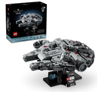 The LEGO Millennium Falcon model is displayed on a stand, with its box visible in the background. The box showcases the LEGO brand logo, the Star Wars logo, and an image of the completed buildable spacecraft.