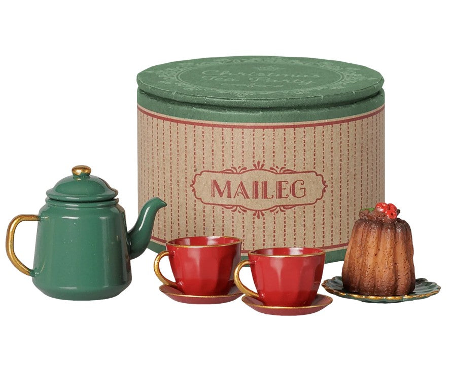 Delight in the Maileg Christmas tea party, Mouse - Red/Green set by Maileg, featuring a charming green teapot, two red cups with matching saucers, a delectable dessert on a plate, and a festive round striped box in the background—perfect for hosting magical holiday tea parties with your Maileg mice or adding enchantment to your seasonal playtime.