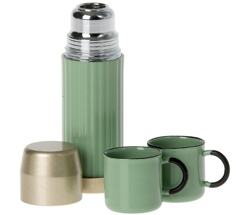 The Maileg Thermos and Cups, Mouse - Mint by Maileg features a mini mint thermos with a metallic lid and two green mugs with black handles—ideal for dollhouse play or as Maileg Mouse accessories. The lid rests in front of the thermos on a white background.