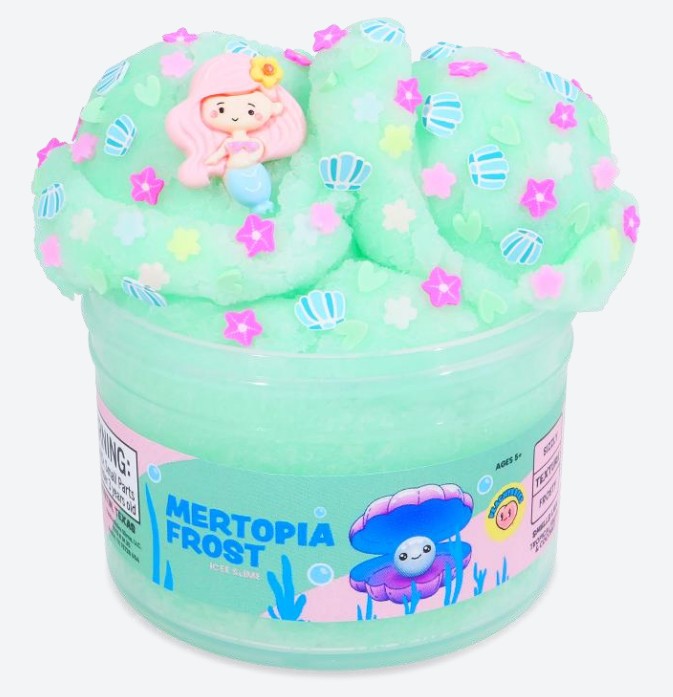 A jar of Peachybbies Slime’s Mertopia Frost Slime, featuring a green, ocean-inspired slime topped with pastel shell and star decorations and a small mermaid figurine, plus an illustrated sea creature on the label—perfect for anyone who loves whimsical ocean-themed sensory slime.