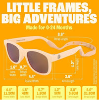 Peach Baby Polarized Sunglasses Strap UV Protection 0-24M by Baby Sunnies are displayed on an orange background, showing labeled measurements such as lens width, bridge width, frame width, lens height, and adjustable strap length. The text reads: “Little Frames, Big Adventures.”.