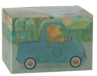 Illustrated box featuring a bear in a hat and plaid shirt driving a blue Maileg Truck, Mouse by Maileg, with the words “Grandpa Truck” partially visible on the top lid.