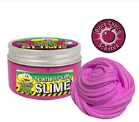 A container of scented fluffy pink slime labeled "Toxic Waste Slime Licker Scented Fluffy Slime" by License 2 Play, perfect for sensory play, featuring a swirl of the fluffy slime and a round logo displaying a cherry with the words "Black Cherry Scented.
