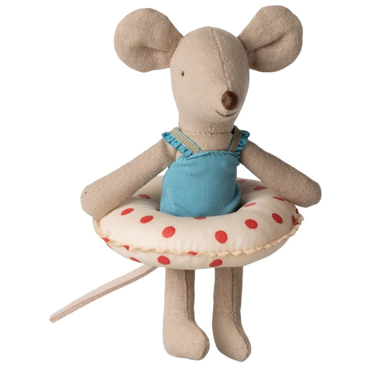 Maileg Beach Mouse With Float, Little Sister - Red Dots by Maileg stands upright in a blue swimsuit with a cream and red polka dot float—ideal for imaginative beach-themed play.