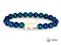 A beaded bracelet called "Shark Week - Deep Sea" from fahlo, featuring blue and green stones and a white sea turtle-shaped charm in the center, inspired by marine conservation efforts. The fahlo logo appears in the bottom right corner.