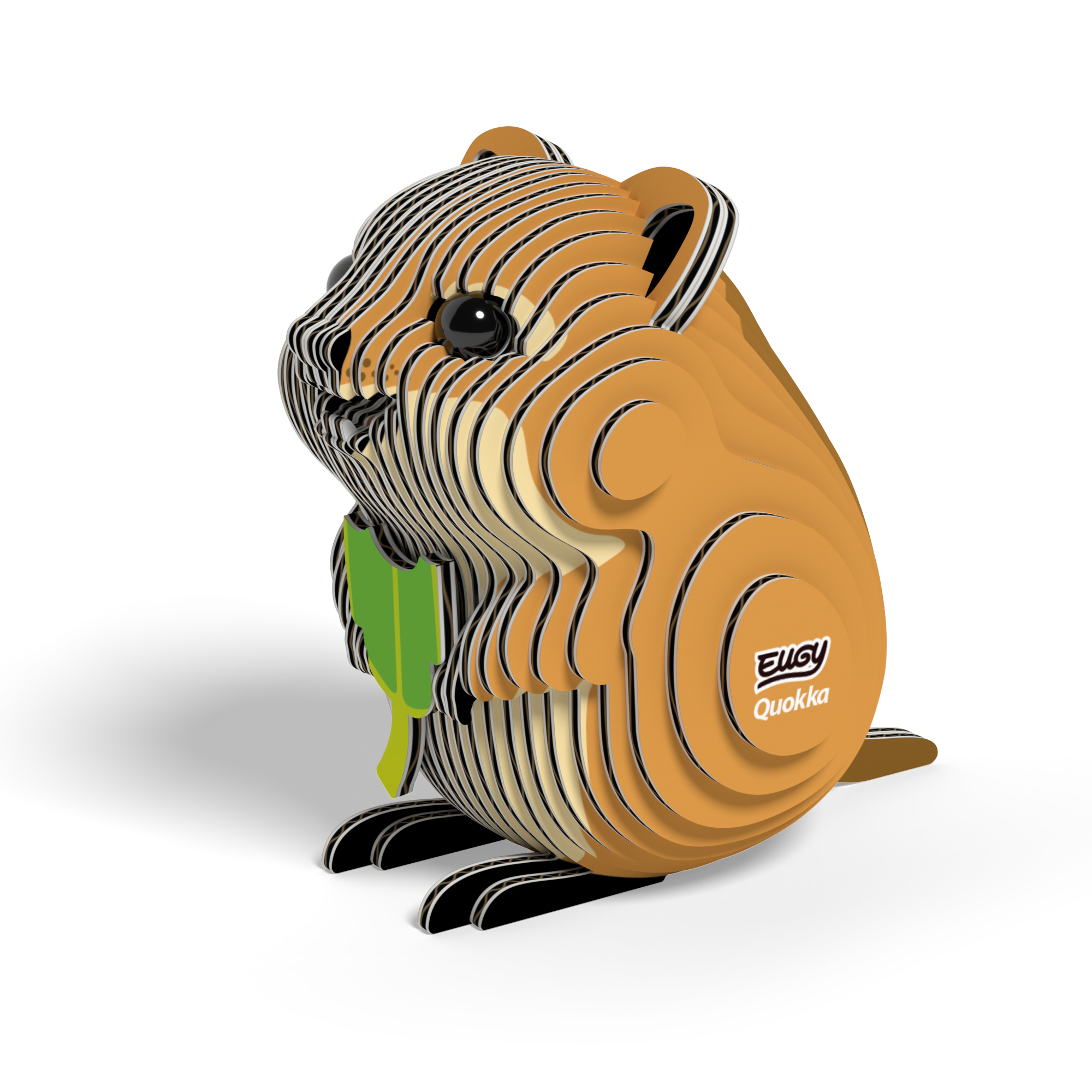 A small, eco-friendly cardboard model of a brown and tan quokka with black eyes, holding a green leaf. The EUGY Quokka 3D Puzzle by Eugy features a layered design and has "EUGY Quokka" printed on its side, displayed against a white background.