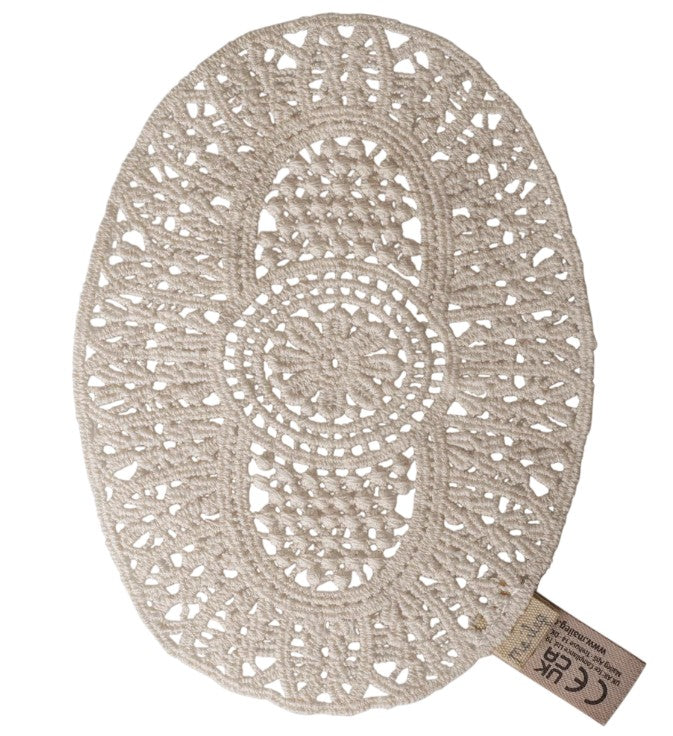 Maileg Lace rug, Mouse by Maileg: An oval-shaped, beige crocheted doily featuring intricate patterns—ideal as a lace rug for Maileg mouse miniature play—with a fabric tag attached to one edge.
