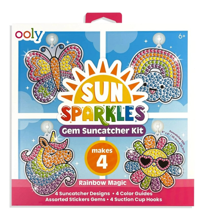 The Ooly Sun Sparkles: Gem Suncatcher Kit - Rainbow Magic box showcases vibrant gem designs—including a butterfly, rainbow, unicorn, and flower—and states that it creates 4 sparkling suncatchers. The kit comes with gems, guides, and suction cup hooks for a complete window art craft experience.