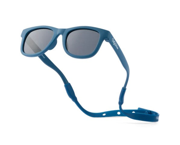 Baby Sunnies Navy Blue Baby Polarized Sunglasses feature dark lenses and a matching navy blue strap to keep them securely in place on your little one’s head. Expertly designed for babies, these sunglasses provide excellent UV protection and are displayed at an angle against a white background.