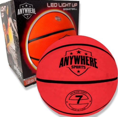 A glowing red Pro Glow Light-Up Basketball No. 7 from Thin Air Brand, LLC sits in front of its box, which displays the words LED Light Up Basketball and an image of the illuminated basketball.