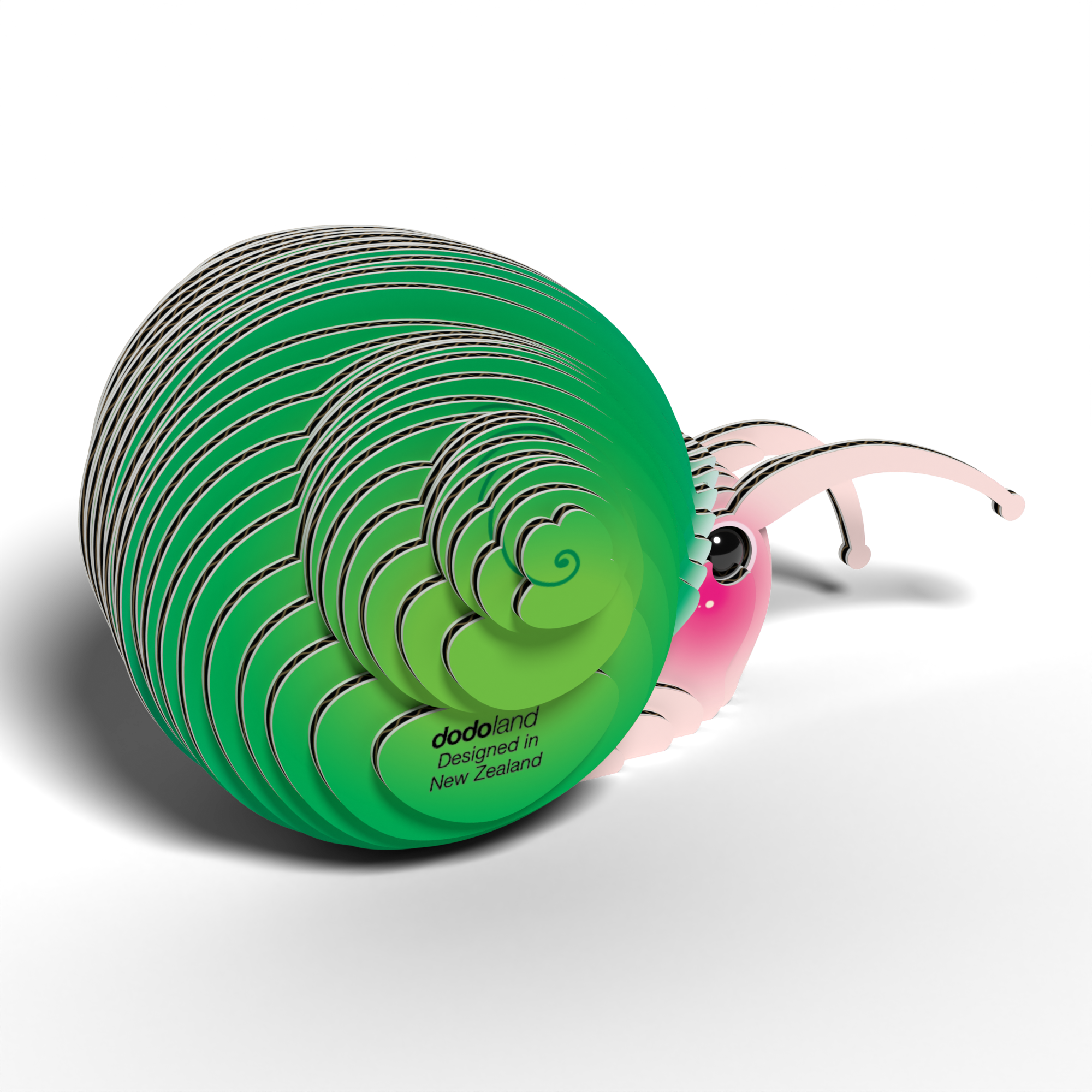 The Eugy EUGY Snail 3D Puzzle features a cute, cartoon snail with a pink face and big eyes peeking from a layered green shell marked "dodoland Designed in New Zealand," inspired by eco-friendly Eugy toy design.