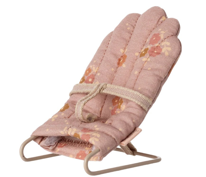 The Maileg Babysitter, My - Rose by Maileg is a small, pink fabric baby bouncer seat with a floral pattern and safety strap—ideal for Maileg My-sized mice or any miniature doll nursery.